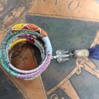 Infinite Possibilities Coiled Kantha & Embroidered Lambani Textile Bracelet with Dove of Peace Medal and Silk Tassel