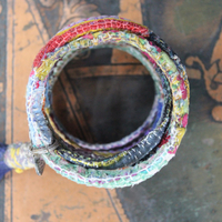 Infinite Possibilities Coiled Kantha & Embroidered Lambani Textile Bracelet with Dove of Peace Medal and Silk Tassel