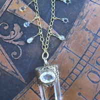 It is a Dawn Necklace w/Antique Gold Mesh Capped Light Citrine Quartz Point,Antique Faceted Rock Crystal Stone & Finding, Faceted Citrine & Clear Rock Quartz Briolletes
