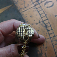 It is a Dawn Necklace w/Antique Gold Mesh Capped Light Citrine Quartz Point,Antique Faceted Rock Crystal Stone & Finding, Faceted Citrine & Clear Rock Quartz Briolletes