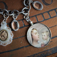 All over the Sky Bracelet w/Antique French Medals, Sterling Chain,Antique Glass Picture Locket, 2 Rare Tiny Glass Bubble Lockets,Antique Sterling "Rattle", Antique MOP Glass Inset Notre Dame Drop & More!