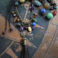 In the Whispers Necklace with Multi Faceted & Polished Gemstones, Antique French Our Lady of Lourdes Medal, Leather Tassel, Leather Ties