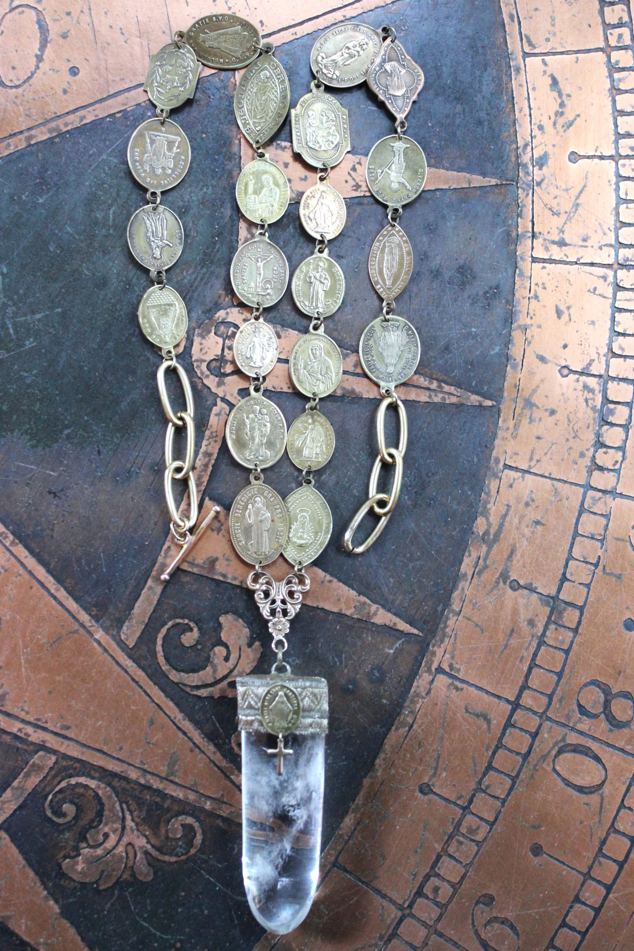 Through You Necklace with Polished Clear Ghost Quartz Pendant, Antique French Vestment Trim, and 22 Antique French Medals