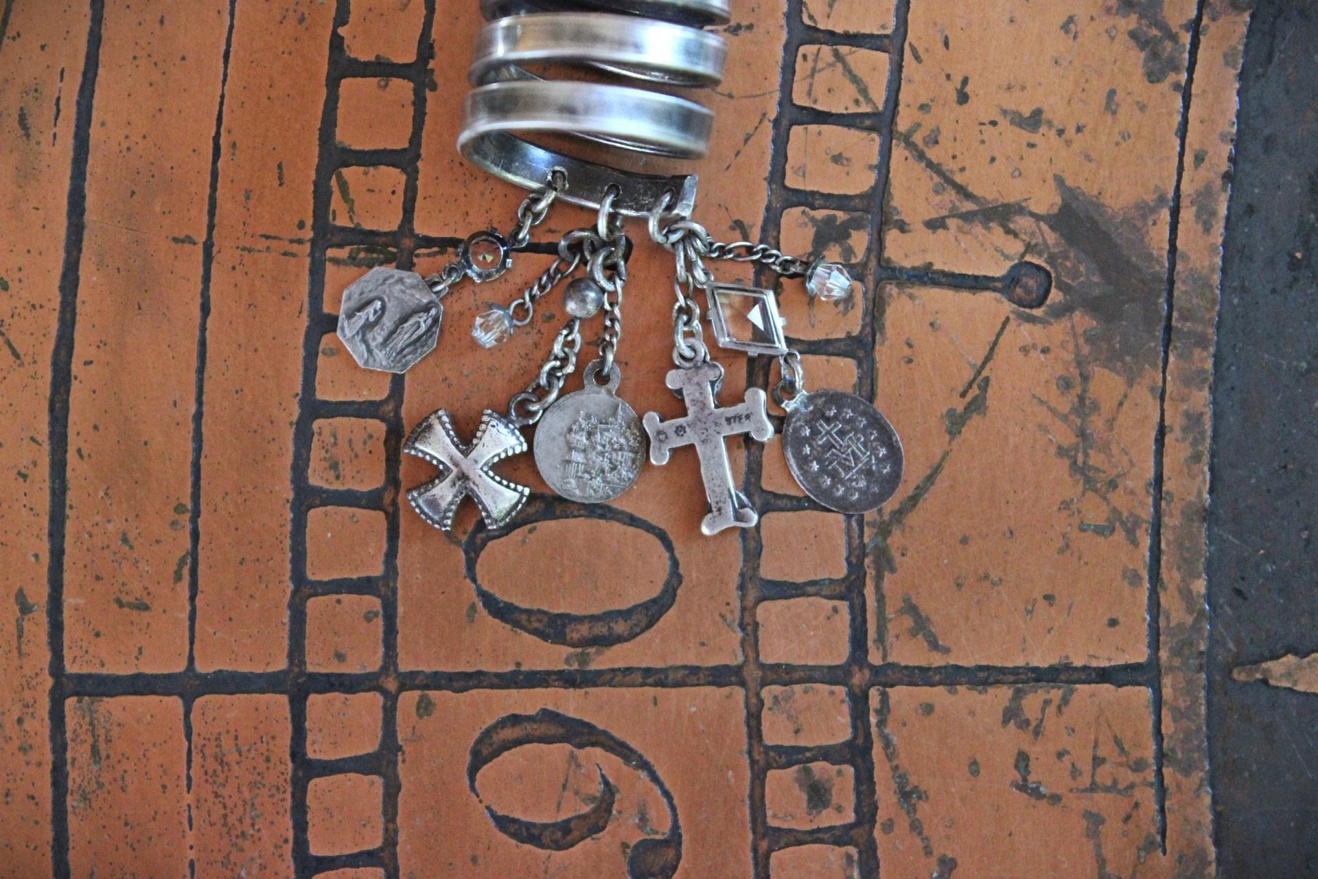 Wide Solid 999 Sterling Artisan Wrap Ring with Multiple Tiny Antique Medals, Sterling Crosses, Faceted Rock Crystal Connectors