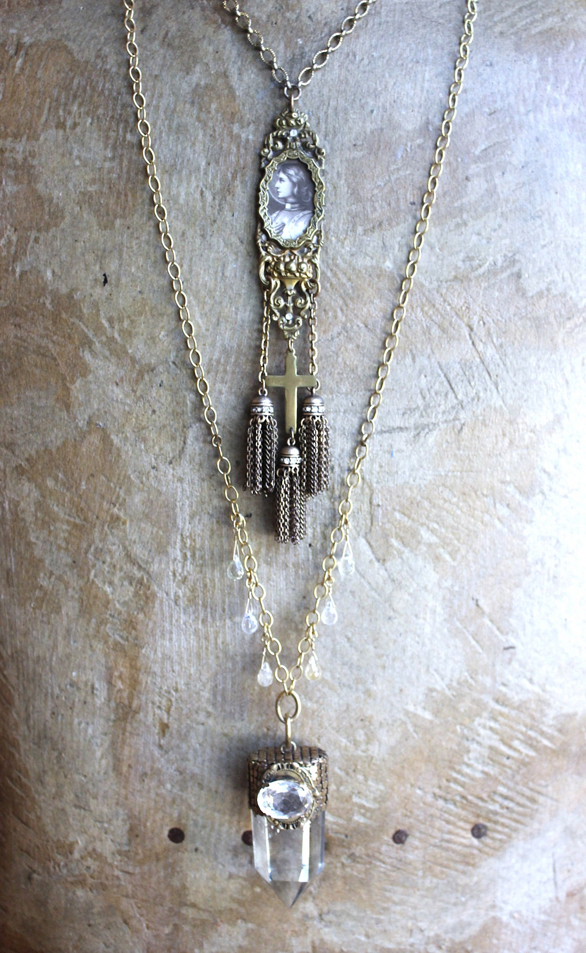 It is a Dawn Necklace w/Antique Gold Mesh Capped Light Citrine Quartz Point,Antique Faceted Rock Crystal Stone & Finding, Faceted Citrine & Clear Rock Quartz Briolletes