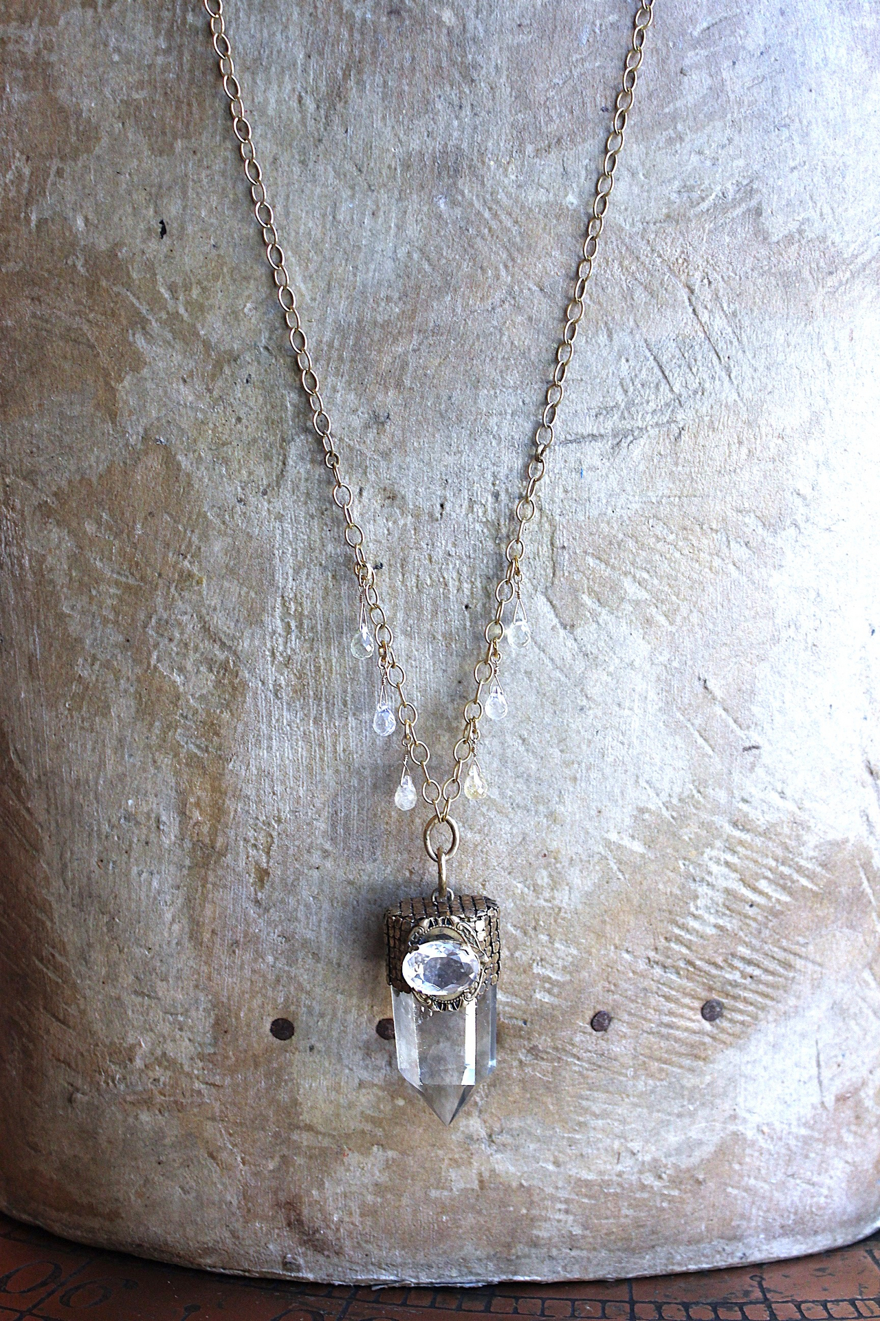 It is a Dawn Necklace w/Antique Gold Mesh Capped Light Citrine Quartz Point,Antique Faceted Rock Crystal Stone & Finding, Faceted Citrine & Clear Rock Quartz Briolletes