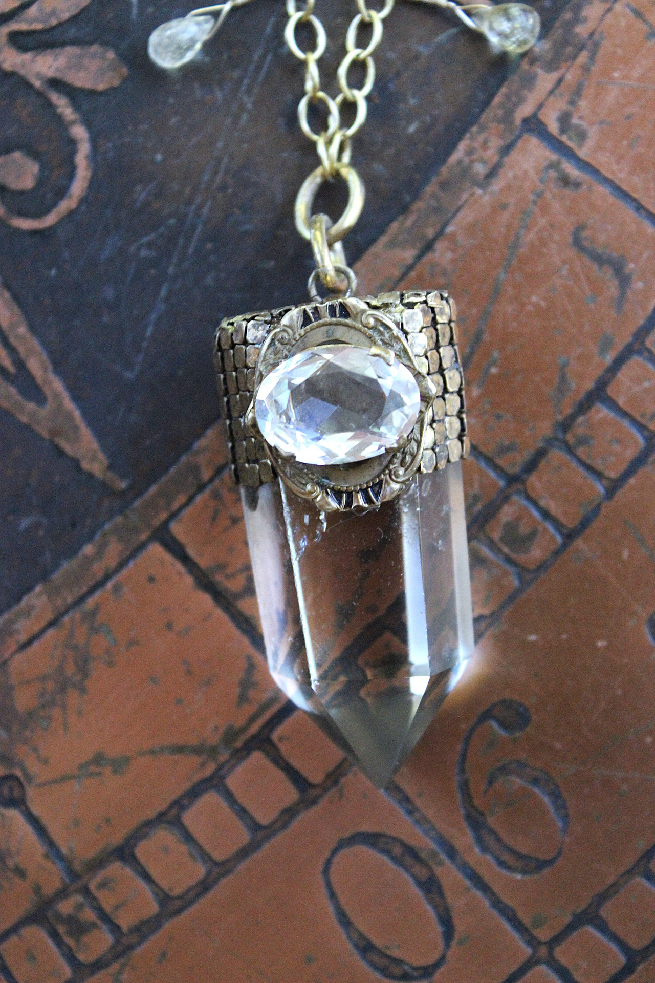 It is a Dawn Necklace w/Antique Gold Mesh Capped Light Citrine Quartz Point,Antique Faceted Rock Crystal Stone & Finding, Faceted Citrine & Clear Rock Quartz Briolletes