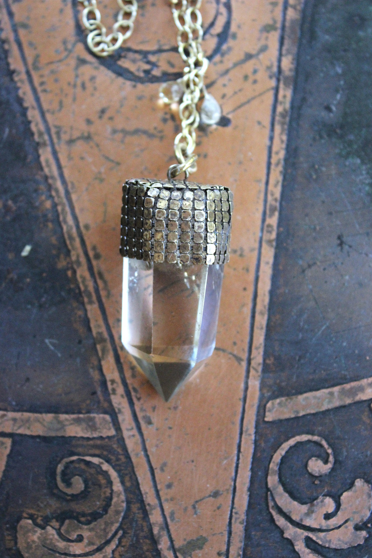 It is a Dawn Necklace w/Antique Gold Mesh Capped Light Citrine Quartz Point,Antique Faceted Rock Crystal Stone & Finding, Faceted Citrine & Clear Rock Quartz Briolletes