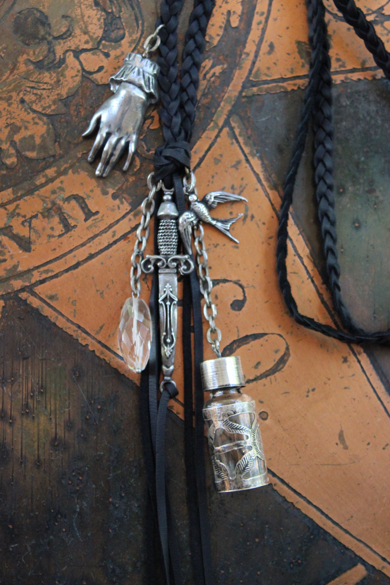 The Wound Necklace w/Long Soft Braided Suede Leather,Antique Sterling Oil/Prayer Vessel,Figural Hand,Bird,Sword + Faceted Rock Crystal