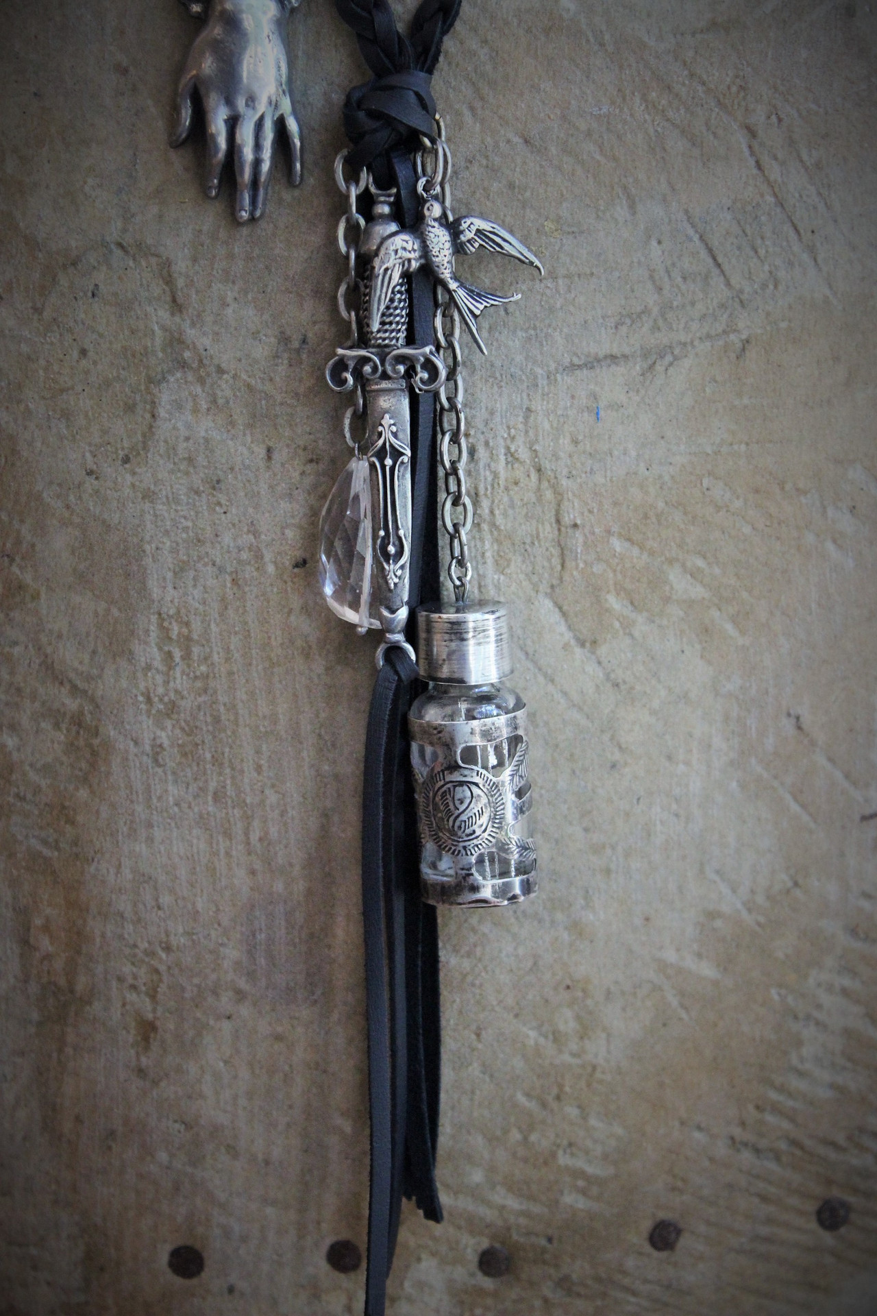 The Wound Necklace w/Long Soft Braided Suede Leather,Antique Sterling Oil/Prayer Vessel,Figural Hand,Bird,Sword + Faceted Rock Crystal