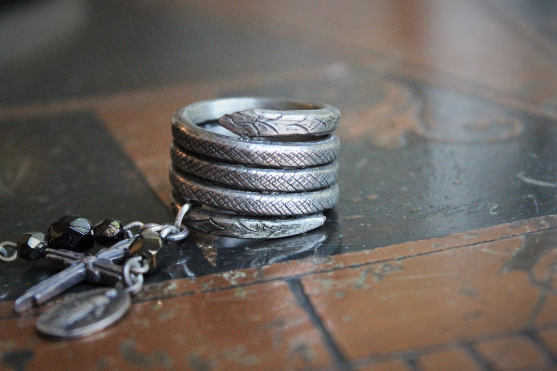 The Triumph Ring w/Antique Sterling Coiled Serpent Band,Antique French Marian & Sacred Heart of Jesus Medals,Antique Sterling Cross,Antique Faceted Glass Bead Connectors