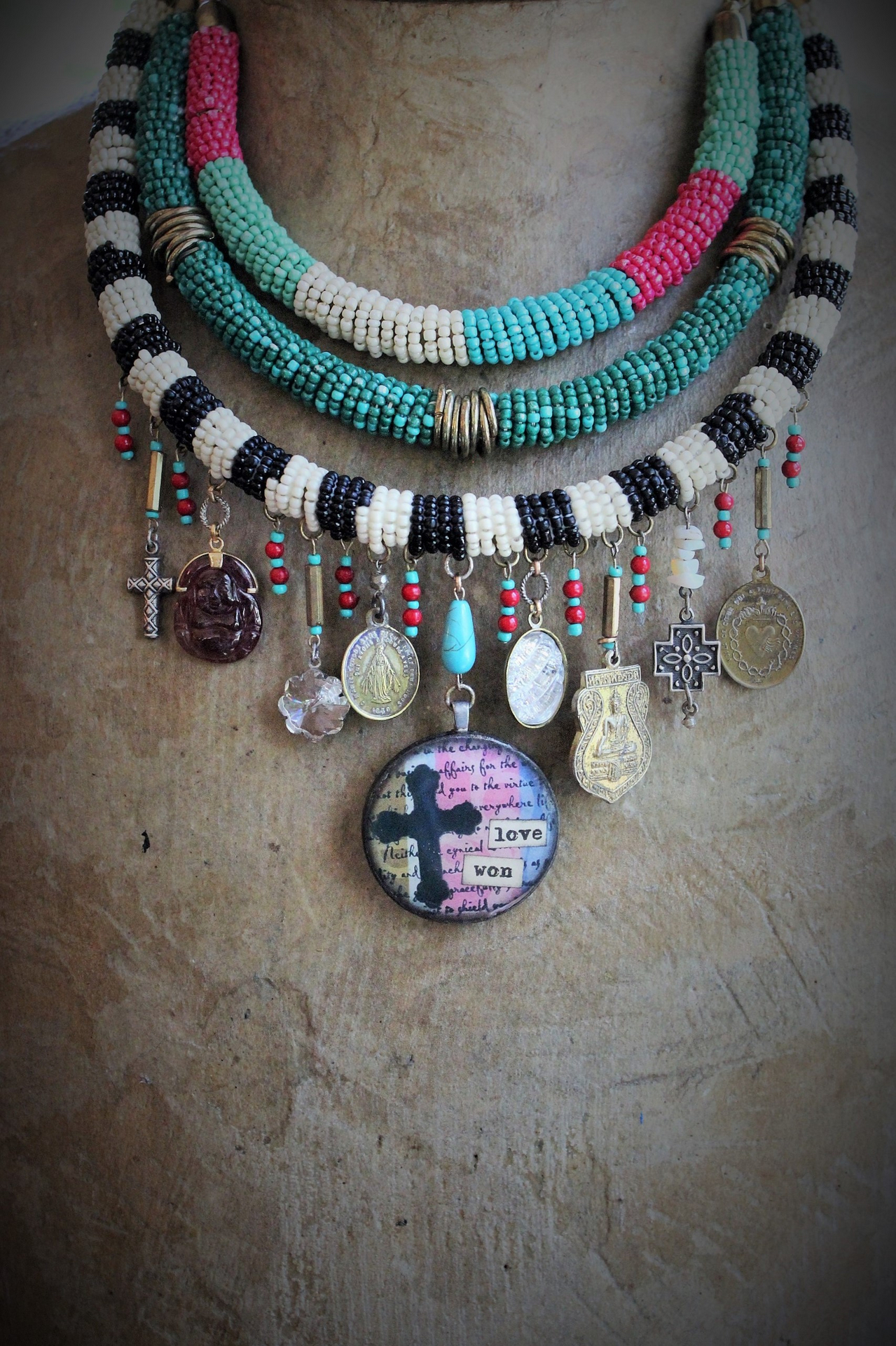 NEW! Peace with your Soul Necklace with Unique 3 Strand Seed Bead Finding,"Love Won" Pendant,Antique French & Tibetan Medals,Carved Tourmaline Buddha & More!