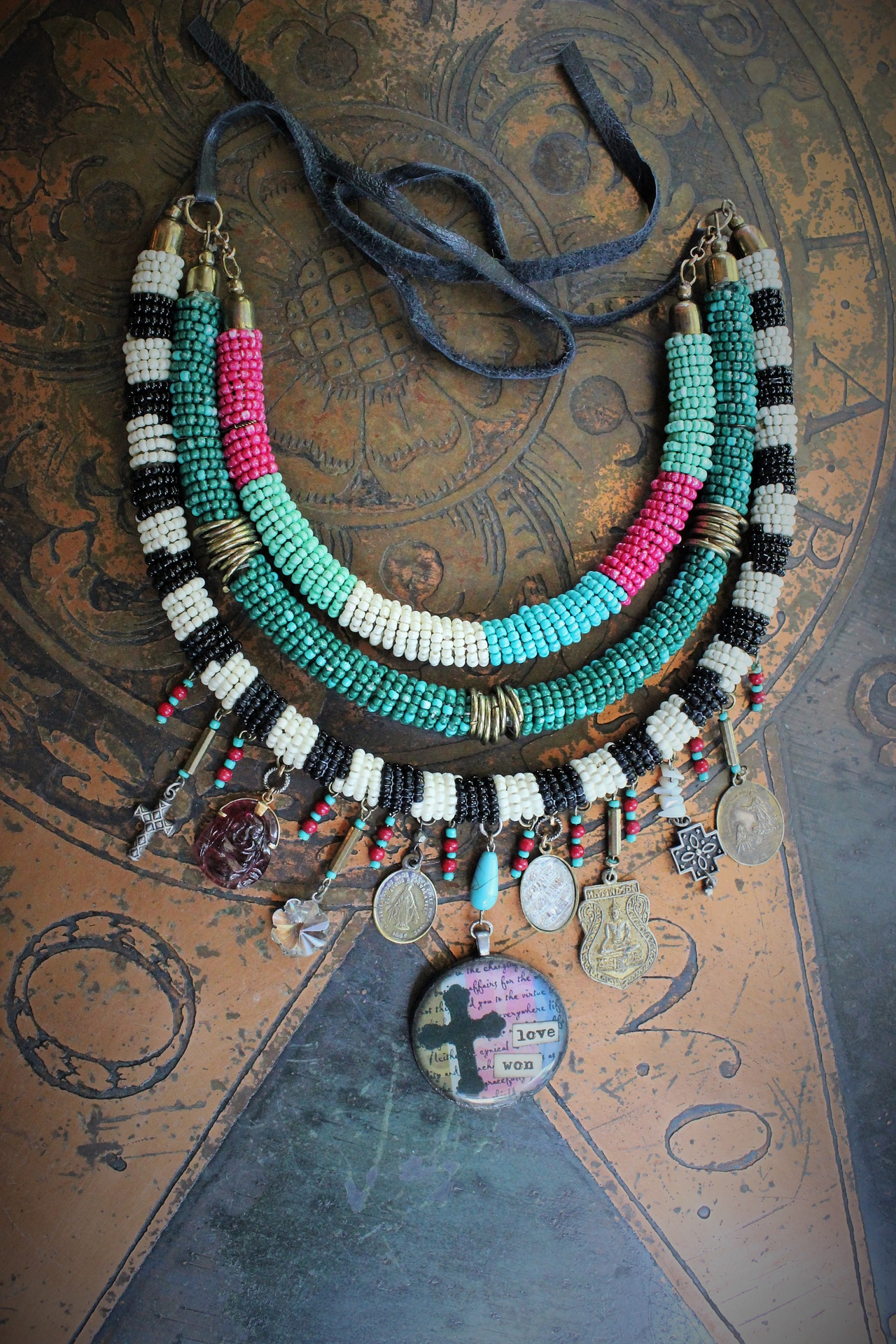 NEW! Peace with your Soul Necklace with Unique 3 Strand Seed Bead Finding,"Love Won" Pendant,Antique French & Tibetan Medals,Carved Tourmaline Buddha & More!