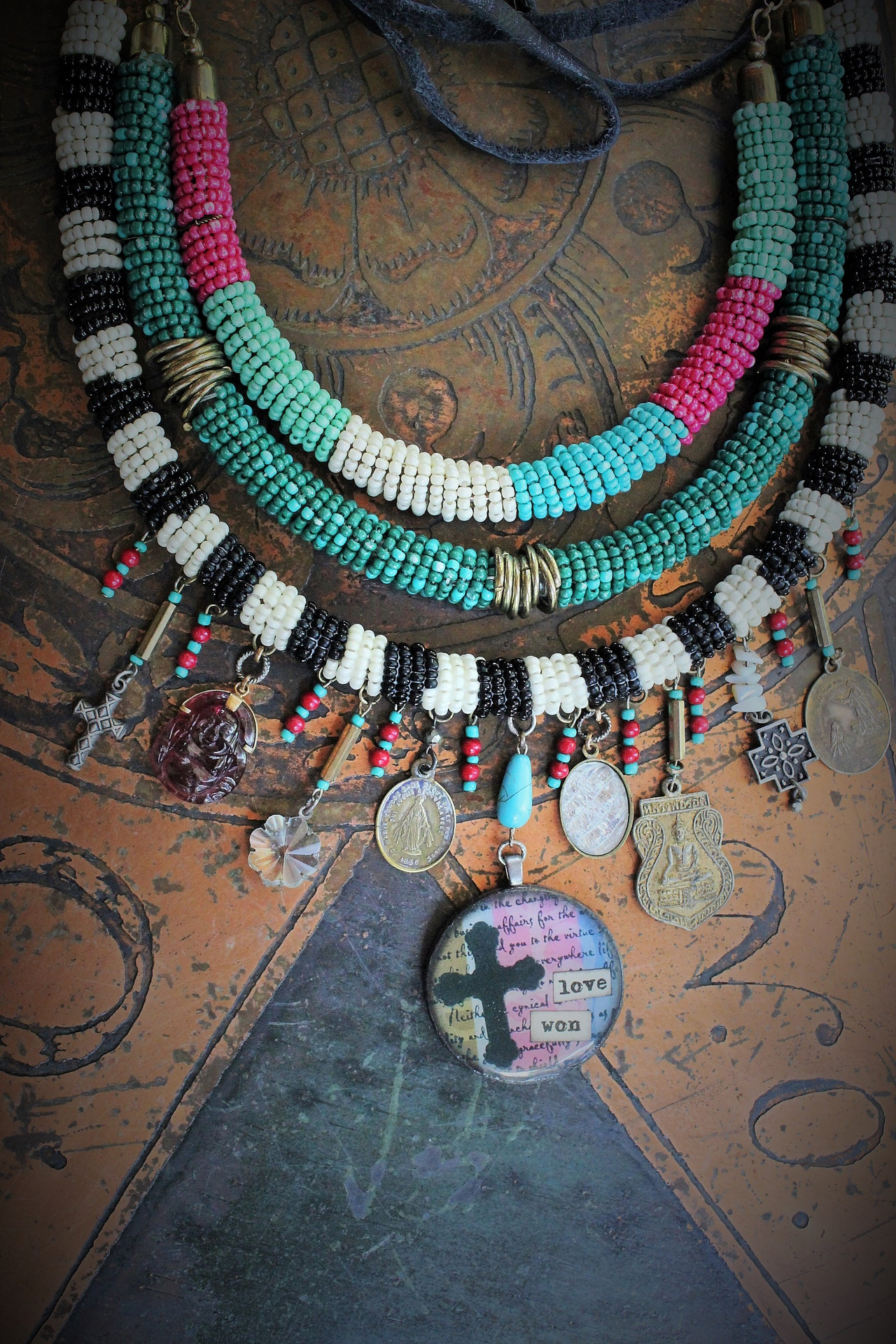 NEW! Peace with your Soul Necklace with Unique 3 Strand Seed Bead Finding,"Love Won" Pendant,Antique French & Tibetan Medals,Carved Tourmaline Buddha & More!