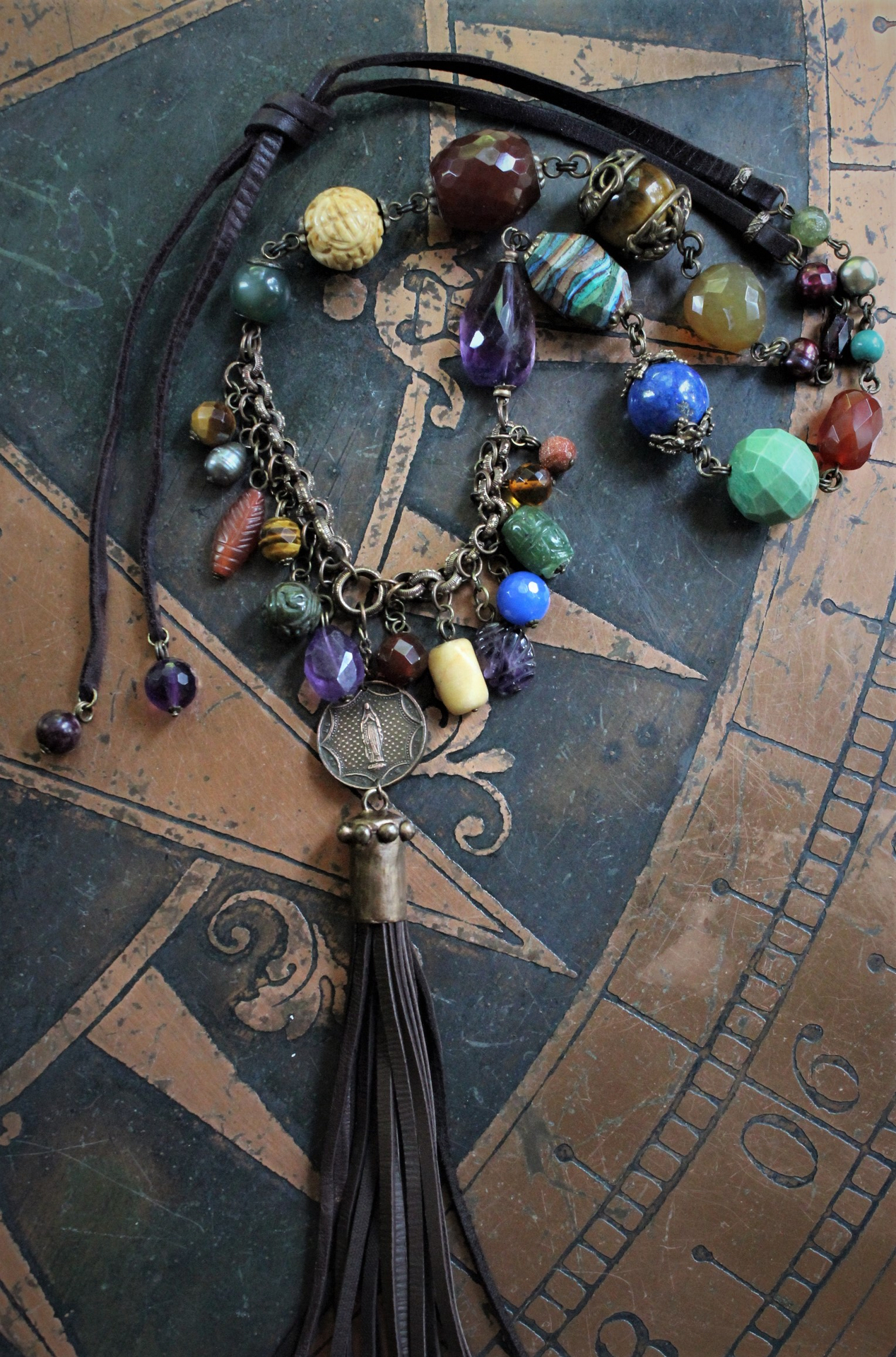 In the Whispers Necklace with Multi Faceted & Polished Gemstones, Antique French Our Lady of Lourdes Medal, Leather Tassel, Leather Ties